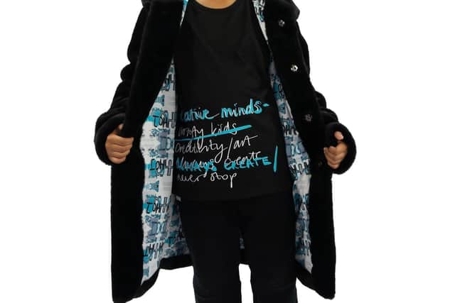 Long-sleeve cotton top, now £32.99; black faux fur coat with illustrated face print back and lining. now £98.99, from House of Juniors at www.houseofjrs.co.uk