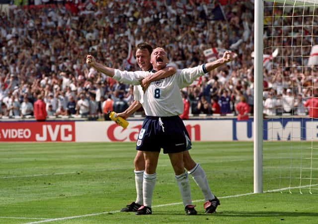 Flashback: Paul Gascoigne celebrating his goal with Teddy Sheringham in the Euro 96 clash against Scotland. Photo: Neil Munns/PA Wire.