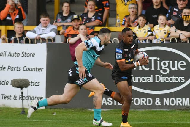 Castleford Tigers' Jason Qareqare rounds Hull FC's Jake Connor to score a try on his senior debut at the age of 17, with his first touch and after just 45 seconds. (JONATHAN GAWTHORPE)