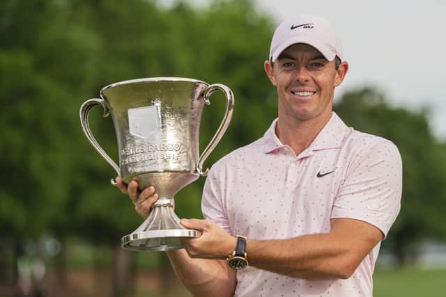 Winner again: Rory McIlroy holds the trophy after winning the Wells Fargo Championship at Quail Hollow. Picture: AP