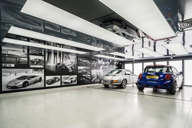 The car gallery/showroom for up to six cars is open plan to the lounge area so car enthusiast Adrian can enjoy looking at his vehicles. This is beautifully lit, decorated and is climate controlled and has a Barrisol ceiling, speaker system and two car underground lift.