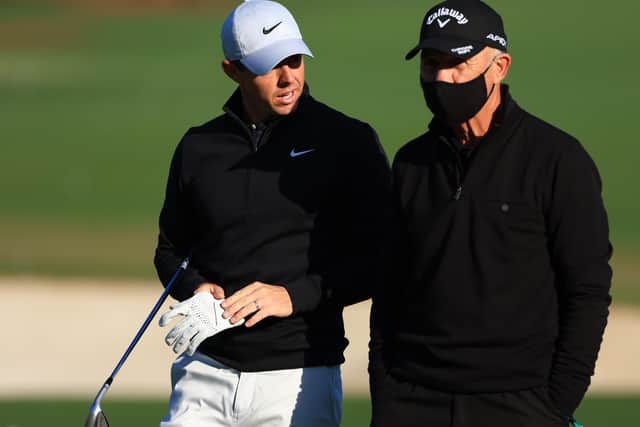 Rejuvenated: Rory McIlroy with coach Pete Cowen on the range during a practice round prior to the Masters. Picture: Getty Images