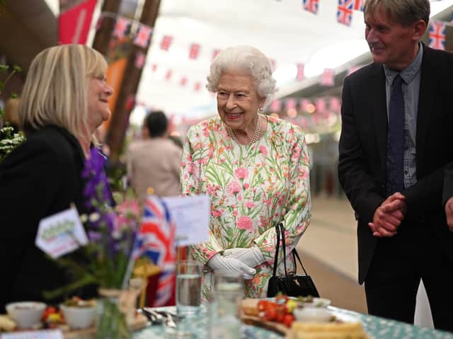 Queen Elizabeth II smiles as she meets people from communities across Cornwall as she attend an event at the Eden Project in celebration of The Big Lunch initiative, during the G7 summit in Cornwall.