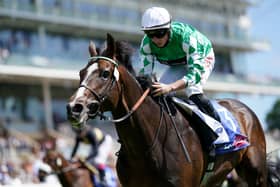 Roberto Escobarr and Tom Marquand coming home to win the Sky Bet Race To The Ebor Grand Cup Stakes at York Racecourse.