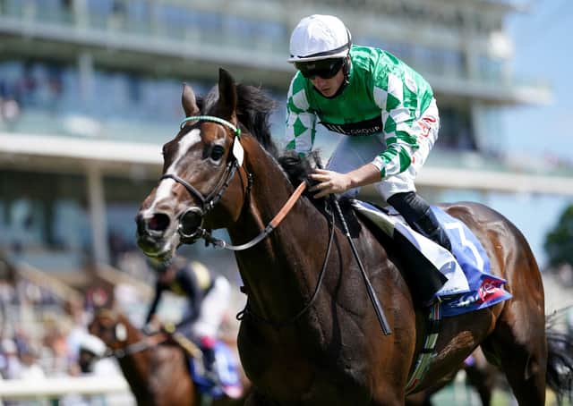 Roberto Escobarr and Tom Marquand coming home to win the Sky Bet Race To The Ebor Grand Cup Stakes at York Racecourse.