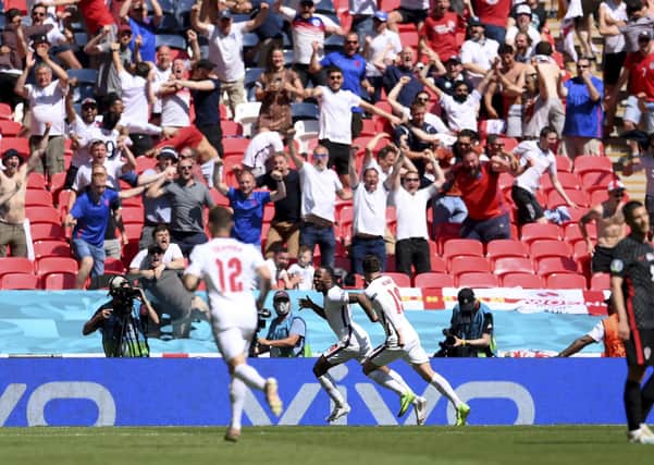 England's Raheem Sterling celebrates after scoring his side's winning goal against Croatia. (Laurence Griffiths, Pool via AP)