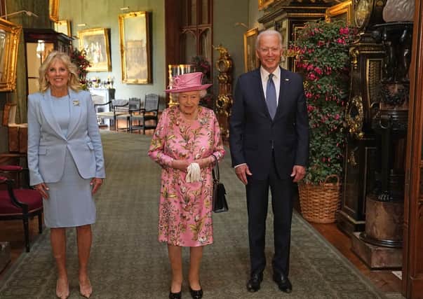 Queen Elizabeth II (centre) with US President Joe Biden and First Lady Jill Biden in the Grand Corridor during their visit to Windsor Castle.
