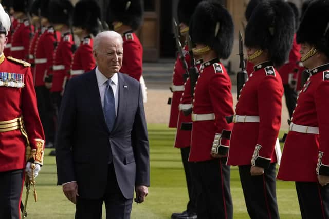 US President Joe Biden inspects a Guard of Honour during a visit to Windsor Castle.