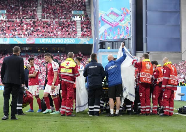 Denmark's Christian Eriksen: Receiving medical treatment after collapsing during the Euro 2020 Group B match between Denmark and Finland in Copenhagen.