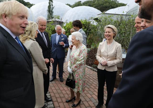 Queen Elizabeth II speaks to US President Joe Biden and his wife Jill as she attends a reception at the Eden Project with Prime Minister Boris Johnson and G7 leaders, during the G7 summit in Cornwall.