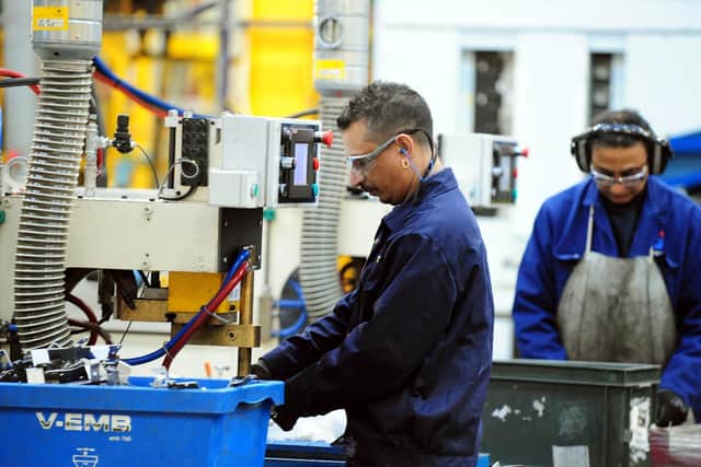 Library image of workers at a manufacturing company