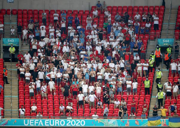 Keeping restrictions: England fans bunched up in the stands during the UEFA Euro 2020 Group D match at Wembley.
