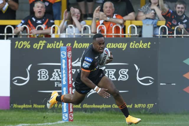 Drmatic debut: Castleford Tigers' Jason Qareqare scores their first try against Hull FC.
