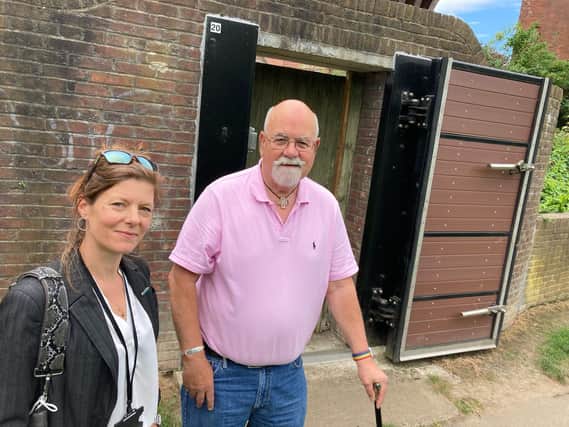 Yarm riverside residents Alan Moffitt and Rachel Dodd with a floodgate along the River Tees