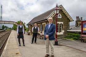 Adrian Quine, right, with Emilia Steven and Alan Collinson from Rail Charter Services Ltd at Settle railway station.Picture by Tony Johnson.
