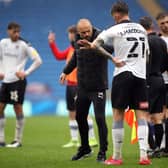 Cost of the drop: Rotherham United manager Paul Warne and Angus MacDonald after their relegation is confirmed at the Cardiff City Stadium. Picture: PA