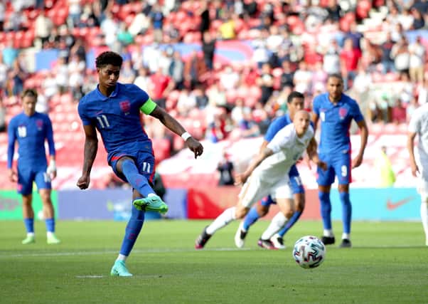 England's Marcus Rashford scores their side's first goal of the game from the penalty spot during the international friendly match against Romania.