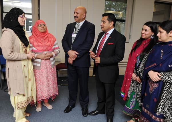 Dr Mohammed Ali OBE (centre), who is chief executive of the Bradford-based QED Foundation, at one of the organisation's events/