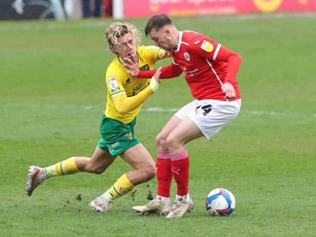 DEBUT: Jasper Moon holds off Norwich City's Todd Cantwell on his first Championship start, in May