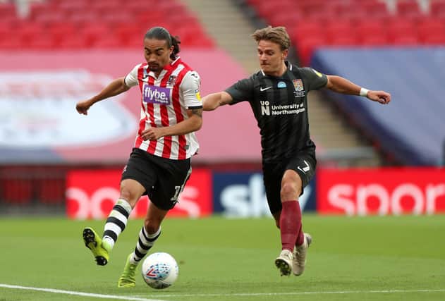 Got him: Exeter City's Randell Williams (left) has signed for Championship new boys Hull City. Picture: Mike Egerton/PA Wire.