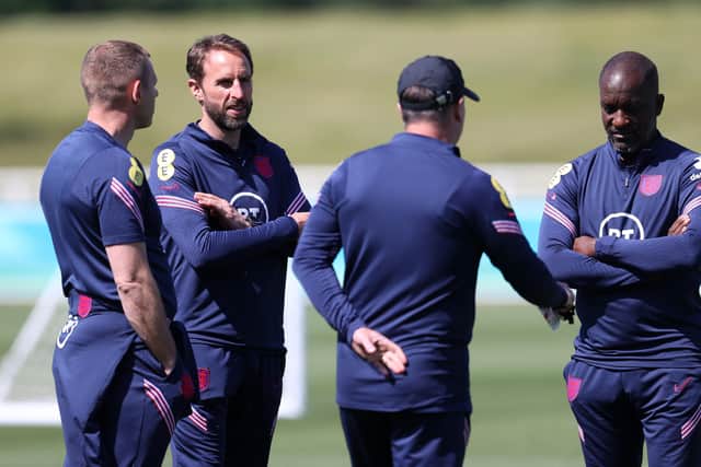 DECISIONS, DECISIONS: Gareth Southgate, chats with his coaching team at St George's Park. Picture: Catherine Ivill/Getty Images