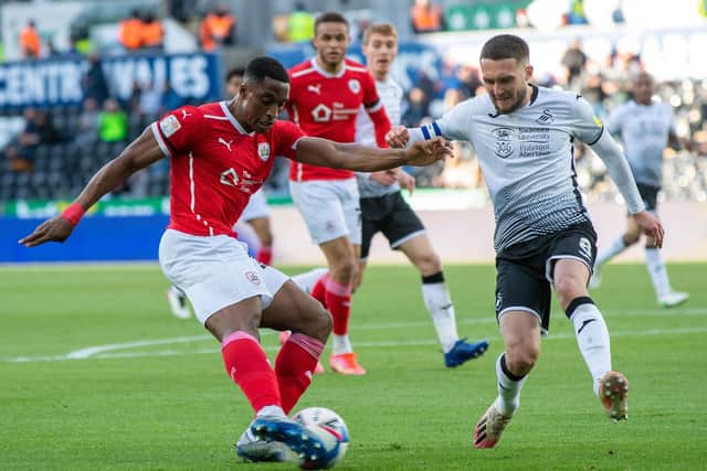 Victor Adeboyejo feeds through a cross past Matt Grimes of Swansea City in the Championship play-off semi final second leg (Picture: Bruce Rollinson)