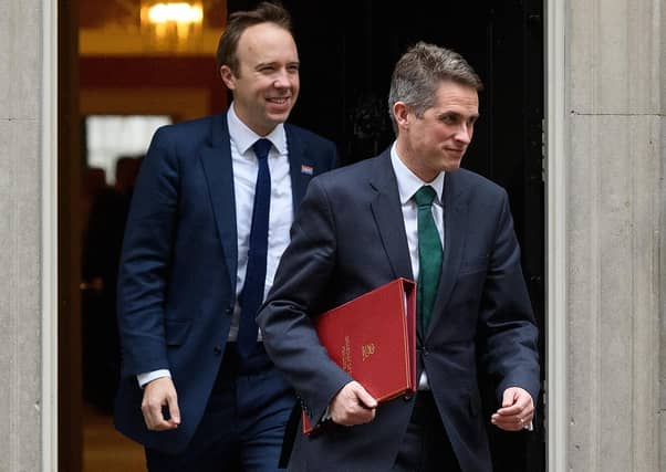 Matt Hancock follows Gavin Williamson out of a past Cabinet meeting.