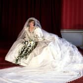 Diana, Princess of Wales in her bridal gown at Buckingham Palace after her marriage to Prince Charles at St Paul's Cathedral. The wedding dress is on show at Kensington Palace for the first time in 25 years.  PA/PA Wire