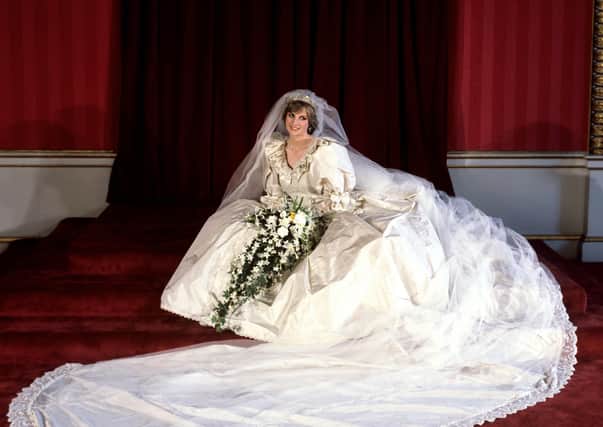 Diana, Princess of Wales in her bridal gown at Buckingham Palace after her marriage to Prince Charles at St Paul's Cathedral. The wedding dress is on show at Kensington Palace for the first time in 25 years.  PA/PA Wire