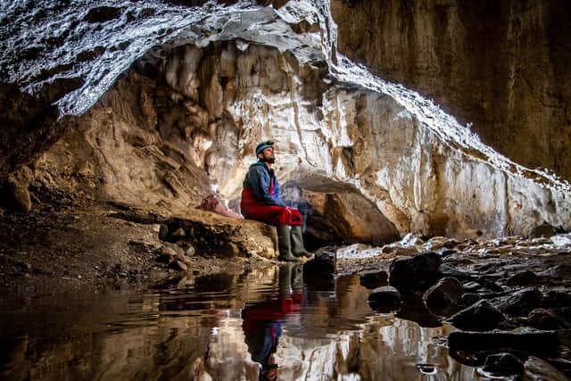 Richard Goodey, from Lost Earth Adventures, admiring the amazing internal cave structure of the Valley Entrance which leads to the Kingsdale Master Cave near Ingleton in the heart of the Yorkshire Dales. Picture: James Hardisty.