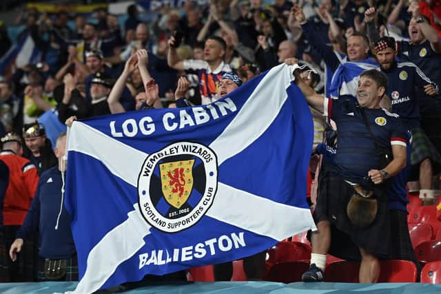 Scotland fans celebrate after the Euro 2020 soccer championship group D match between England and Scotland at Wembley stadium in London. (Justin Tallis/Pool via AP)