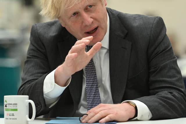 Boris Johnson pictured in West Yorkshire this week. (Photo by Oli SCARFF / POOL / AFP) (Photo by OLI SCARFF/POOL/AFP via Getty Images)