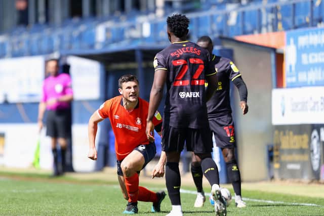 MR ANGRY: Luton Town's Matty Pearson and Watford's Isaac Success exchange words after a clash during their Championship clash at Kenilworth Road on April 17. Picture: Richard Heathcote/Getty Images
