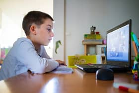 Child at home having remote school on laptop computer. Picture: Adobe Stock