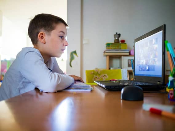 Child at home having remote school on laptop computer. Picture: Adobe Stock