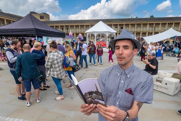 Poet Keiron Higgins reading at the Great Get Together event at the Piece Hall, Halifax
