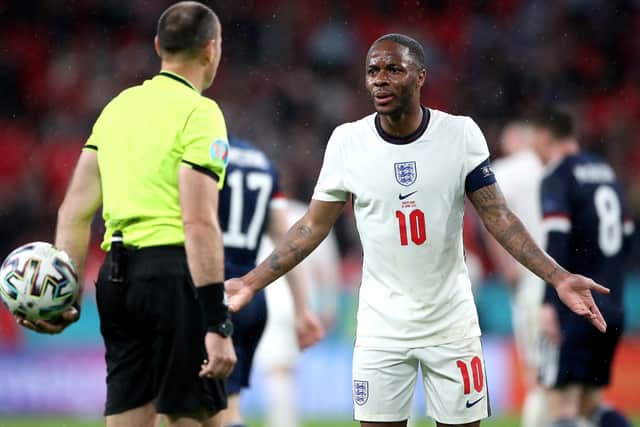 England's Raheem Sterling argues with referee Antonio Miguel Mateu Lahoz at Wembley Stadium. Picture: Nick Potts/PA