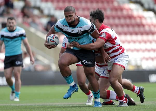 Out of my way: Hull FC's Tevita Satae is challenged during the Super League match at Leigh Sports Village. Picture: PA