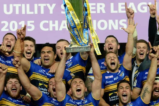 Treble-winner: Leeds Rhinos captain Kevin Sinfield lifts the trophy after winning the Super League Grand Final at Old Trafford in 2015. Picture: PA