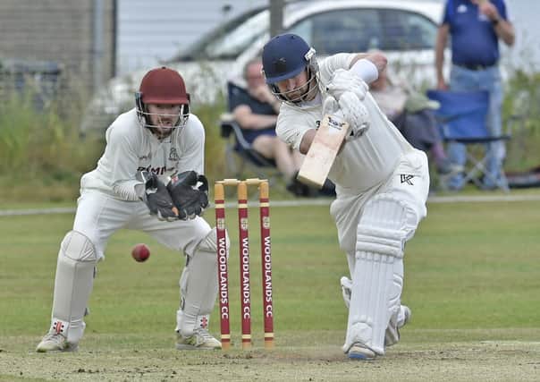 Driving force: 
Lee Goddard of New Farnley who top scored with 48 in their Bradford League defeat to Woodlands. Picture: Steve Riding