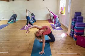 People enjoying a yoga class at The Stables Yoga Centre in York
