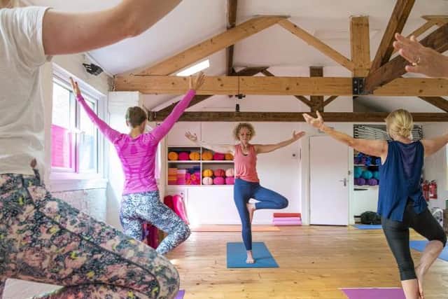Students putting their balance to the test at The Stables Yoga Centre