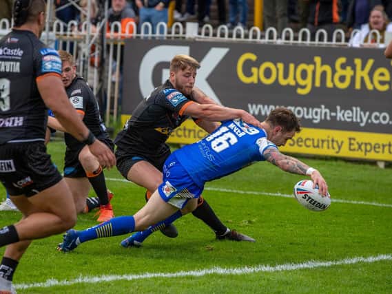 Richie Myler scores for Rhinos in their win at Castleford on May 28, the last game they played before a coronavirus outbreak led to training being cancelled. Picture by Bruce Rollinson.