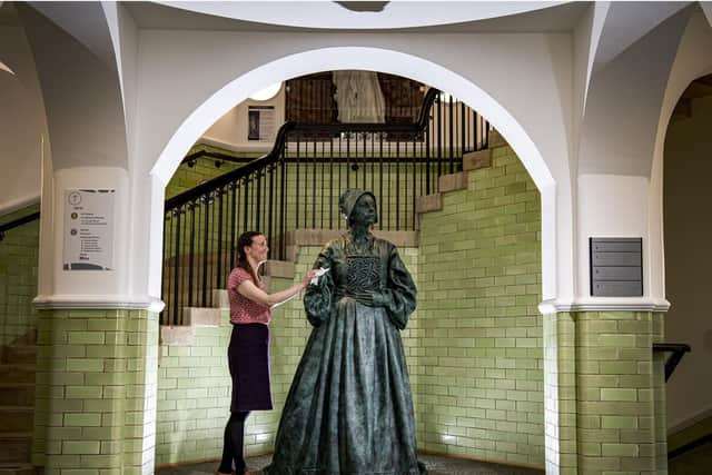 Kim Drabyk, Heritage Services Manager with the bronze sculpture of the pilgrim woman displayed in the new Danum Gallery, Library and Museum in Doncaster.  Picture: Tony Johnson