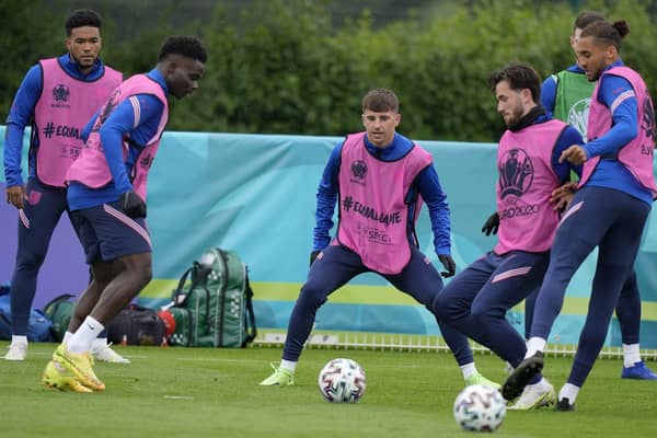 WAITING GAME: England’s Mason Mount, third left, and England’s Ben Chilwell, fourth left, during a team training session yesterday. Picture: AP/Frank Augstein.