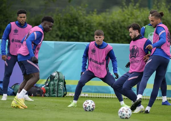 WAITING GAME: England’s Mason Mount, third left, and England’s Ben Chilwell, fourth left, during a team training session yesterday. Picture: AP/Frank Augstein.