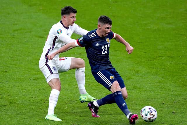 England's Mason Mount (left) battles with Scotland's Billy Gilmour, who has tested positive for coronavirus and will miss Tuesday's Euro 2020 game with Croatia. Picture: Mike Egerton/PA