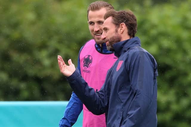 England's Harry Kane with manager Gareth Southgate during a training session at Hotspur Way training ground. Picture: Nick Potts/PA