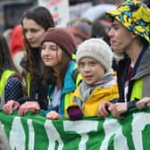 Environmental activist Greta Thunberg (centre) marches during a Youth Strike 4 Climate protest in Bristol.