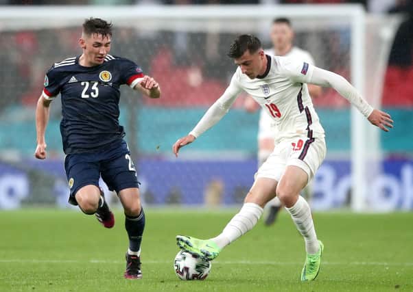 SIDELINED: Scotland's Billy Gilmour (left) and Mason Mount battle for the ball at Wembley on Friday night. Picture: Nick Potts/PA